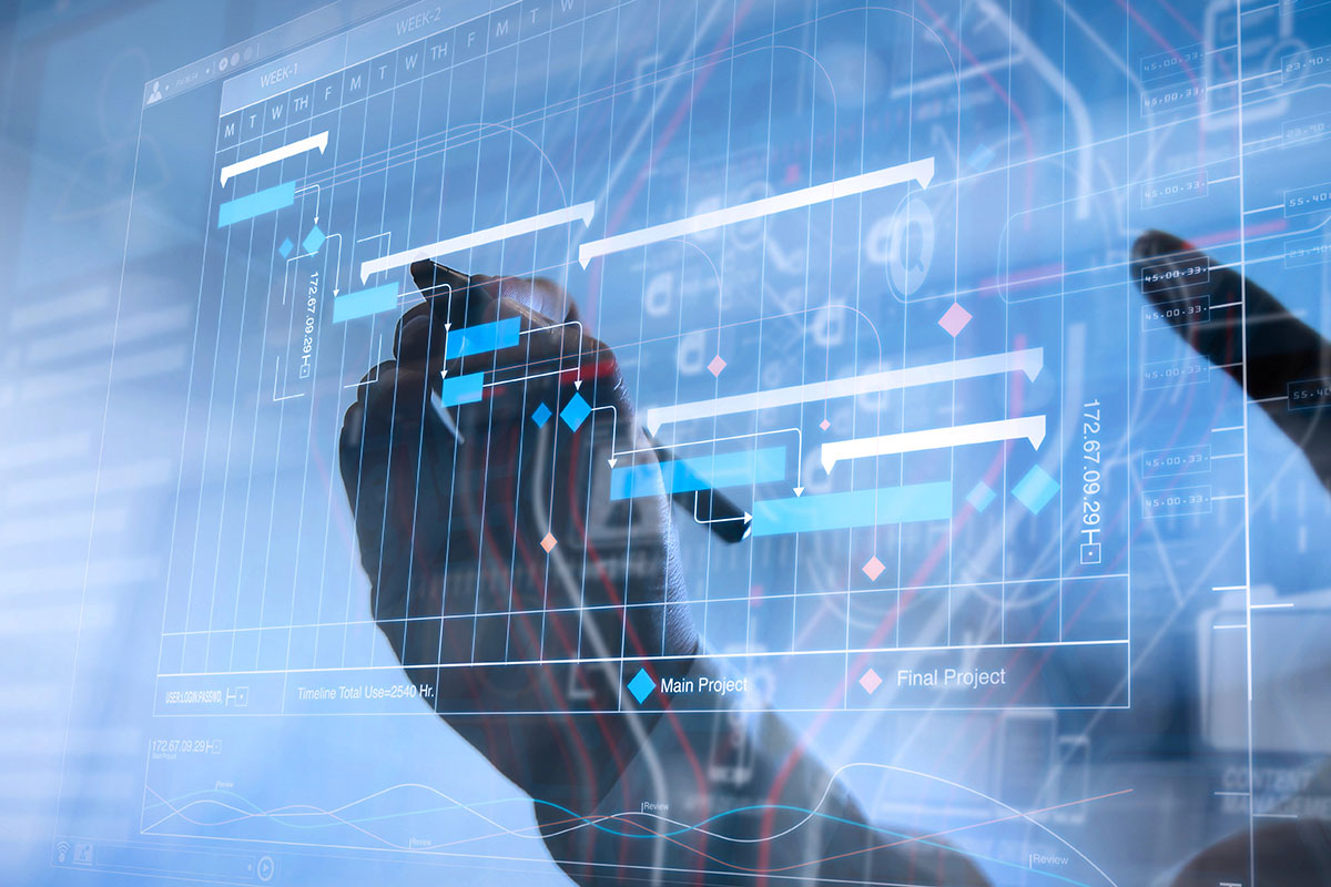 business-continuity-planning A close-up of a hand holding a stylus, interacting with a digital project management interface displaying graphs, timelines, and colored data points.